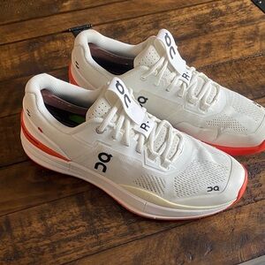 On Running Athletic Shoes in White and Orange